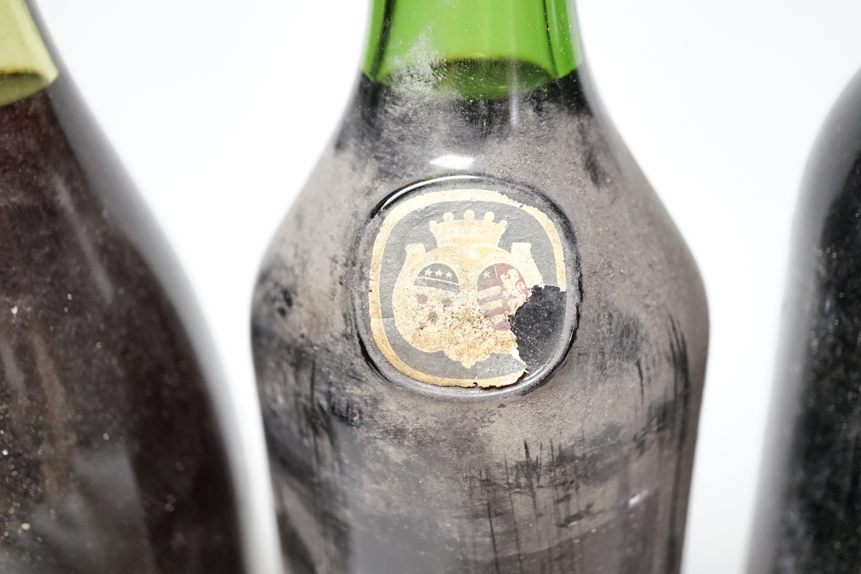 Four bottles of wine including one Chateau Haut-Brion, 1966 and three others including Rauzan-Segla, Margaux.